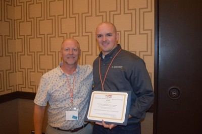 Dr. Dave Coyle and Bill Hubbard receive the award.